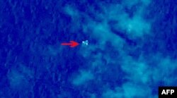 Handout photo provided by China Center for Resources Satellite Data and Application shows satellite image taken from space, illustrating objects in a "suspected crash sea area" in the South China Sea on March 9, 2014, thought to possibly be from the miss