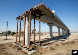 FILE - One of the elevated sections of the high-speed rail under construction in Fresno, California.