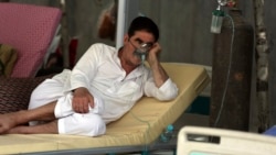 A patient is connected to an oxygen tank at the Afghan-Japan Communicable Disease Hospital, for COVID-19 patients in Kabul, Afghanistan, Thursday June 18, 2020. (AP Photo/Rahmat Gul)