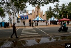 Soldiers guard outside St. Joseph's church in Thannamunai, Sri Lanka, April 30, 2019.
