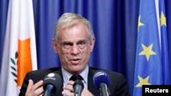 Cyprus' Finance Minister Michalis Sarris holds a news conference at the end of a Eurogroup meeting at the European Council building in Brussels, March 25, 2013.