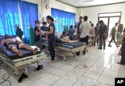 Bomb victims receive treatment in a hospital after two bombs exploded outside a Roman Catholic cathedral in Jolo, the capital of Sulu province in southern Philippines, Jan. 27, 2019, in this photo provided by WESMINCOM Armed Forces of the Philippines.