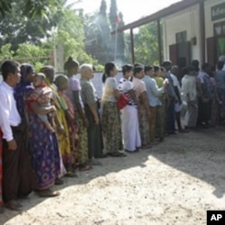 Voters line up at a polling station to cast ballots in Bago, about 90 km northeast of Rangoon.
