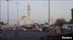 General view of security personnel in front of a mosque as police stage a second controlled explosion, after a suicide bomber was killed and two other people wounded in a blast near the U.S. consulate in Jeddah, Saudi Arabia, July 4, 2016.