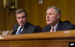Senate Intelligence Committee Chairman. Sen. Richard Burr, R-N.C., right, joined by Vice Chairman Sen. Mark Warner, D-Va., left, speaks at the Senate Intelligence Committee hearing on Capitol Hill in Washington, March 30, 2017.
