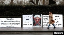 Opponents of Iranian President Hassan Rouhani hold a protest outside the Iranian embassy in west London, Britain, January 2, 2018. REUTERS/Simon Dawson