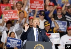 FILE - President Donald Trump speaks during a rally in Huntington, W.Va., Aug. 3, 2017.
