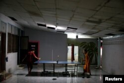 Patients play ping-pong at the rehabilitation and detox area at Wat Thamkrabok monastery in Saraburi province, Thailand, Feb. 8, 2017.