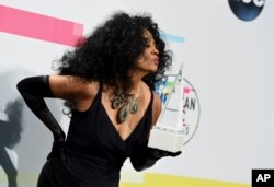 Diana Ross poses in the press room with the lifetime achievement award at the American Music Awards at the Microsoft Theater on Sunday, Nov. 19, 2017, in Los Angeles.