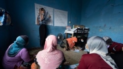 A volunteer teacher gives a basic English lesson to a minority Muslim Rohingya refugees at a slum on the outskirts of Kuala Lumpur, Malaysia, on Oct. 11, 2020.