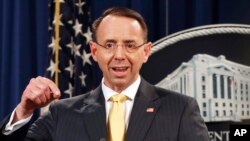 Deputy Attorney General Rod Rosenstein announces that a grand jury has charged 13 Russian nationals and several Russian entities, Feb. 16, 2018, in Washington. The defendants are accused of violating U.S. criminal laws to interfere with American elections