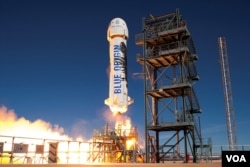 Roket pendorong milik Blue Origin, New Shepartd, kembali berhasil diluncurkan dan melakukan pendaratan dari fasilitas peluncuran milik perusahaan itu di Texas Barat. (Blue Origin)