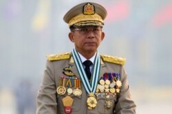 FILE -Myanmar's junta chief Senior General Min Aung Hlaing presides at an army parade on Armed Forces Day in Naypyitaw, Myanmar, March 27, 2021.