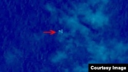 Debris from what could be Malaysian Airlines flight 330 is seen in this satellite image from China's State Administration for Science, Technology and Industry for National Defense.