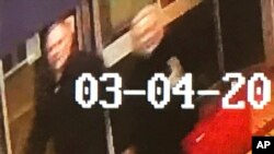 In this image taken from security camera footage from PA shows a man and woman as they walk through an alleyway connecting a Zizzi's restaurant to a bench where former Russian double agent Sergei Skripal was found in Salisbury on Sunday March 4, 2018.