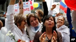 People celebrate the agreement between Revolutionary Armed Forces of Colombia, FARC, and Colombia's government, in Bogota, Colombia, June 23, 2016.