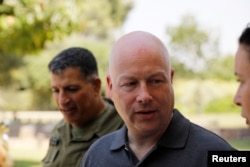 FILE - Jason Greenblatt, center, U.S. President Donald Trump's Middle East envoy, arrives in southern Israel, Aug. 30, 2017.
