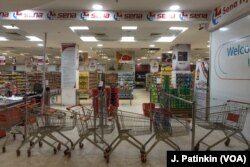 Shopping carts block the entrance to Sena supermarket whose staff are refusing to work as part of Sudan's general strike demanding the military hand power to civilians, in Khartoum, Sudan, May 28, 2019.