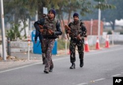 Indian security forces patrol inside the Indian air force base that came under attack Saturday in Pathankot, India, Jan. 3, 2016.