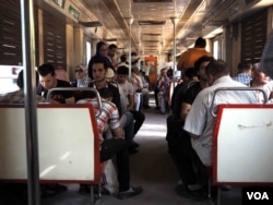 On the Cairo subway some cars are segregated by gender, but this car is mixed. Some transgender people say the general separation of genders in Egyptian society made their childhoods' difficult. Photo taken in Cairo, June 13, 2016. (H. Elrasam/VOA)
