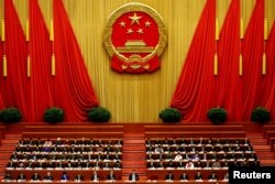 FILE - Participants are seen during a session of the National People's Congress (NPC) at the Great Hall of the People in Beijing, China, in an undated photo.