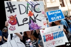 Demonstrators make their way around downtown, Monday, July 25, 2016, in Philadelphia, during the first day of the Democratic National Convention after some of the 19,000 emails, presumably stolen from the DNC by hackers, were posted to the website Wikileaks.