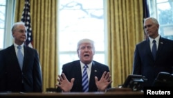 President Trump reacts to the pulling of the American Health Care Act by congressional Republicans before a vote as he appears with Secretary of Health and Human Services Tom Price (left) and Vice President Mike Pence (right) in the Oval Office of the Whi