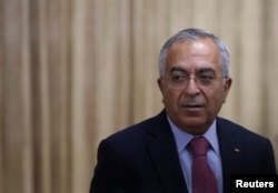 FILE - Salam Fayyad, Palestinian prime minister at the time, attends a reception at the Conference on Cooperation Among East Asian Countries for Palestinian Development in Tokyo, Japan, Feb. 13, 2013.