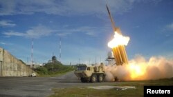FILE - A Terminal High Altitude Area Defense (THAAD) interceptor is launched during a test, in this undated handout photo provided by the U.S. Department of Defense.