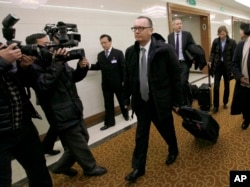 FILE - U.N. Undersecretary-General for Political Affairs Jeffrey Feltman, center, walks upon arrival at the Pyongyang International Airport in Pyongyang, North Korea, Dec. 5, 2017.