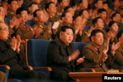 FILE - North Korean leader Kim Jong Un (C) applauds during a concert marking the 70th founding anniversary of the Korean People's Army (KPA) military band in this undated photo released by North Korea's Korean Central News Agency (KCNA) in Pyongyang.