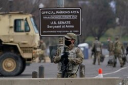 Extensive security surrounds the U.S. Capitol in Washington, Friday, Jan. 15, 2021, ahead of the inauguration of President-elect Joe Biden and Vice President-elect Kamala Harris. (AP Photo/Susan Walsh)