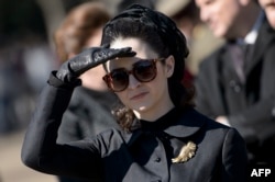 FILE - Actress Natalie Portman, in the role of Jacqueline Kennedy, is seen outside the White House while filming a scene for the movie "Jackie" on Pennsylvania Avenue February 28, 2016 in Washington, DC.
