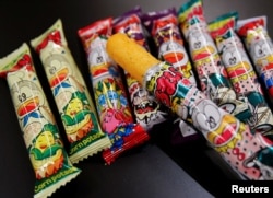 Several kinds of 'Umaibo', a popular Japanese corn snack, are seen at a store in Tokyo, Japan January 25, 2022. (REUTERS/Akira Tomoshige)