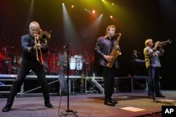 FILE - James Pankow, Walter Parazaider and Lee Loughnane of Chicago perform in Hollywood, Fla., April 4, 2013.