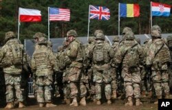 US troops, part of a NATO mission, preparing for a welcoming ceremony in Poland, April 13, 2017