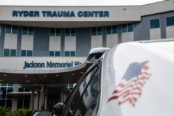 An emergency vehicle is parked at the entrance of Ryder Trauma Center where Haitian first lady Martine Moise was taken for treatment in Miami, July 7, 2021.