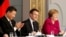 French President Emmanuel Macron, Chinese President Xi Jinping and German Chancellor Angela Merkel hold a news conference at the Elysee presidential palace in Paris, March 26, 2019. 