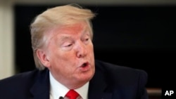 President Donald Trump speaks about reopening the country, during a roundtable with industry executives in the State Dinning Room of the White House on April 29, 2020, in Washington. 