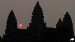 In this file photo, the sun rises behind Angkor Wat at the eastern site of Siem Reap province, some 230 kilometers (143 miles) northwest of Phnom Penh, Cambodia. (AP Photo/Heng Sinith)