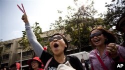 Thai anti-government protestors march at a Red Shirt protest rally in Bangkok, Thailand, February 19, 2011