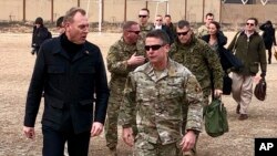Acting Defense Secretary Pat Shanahan, left, arrives in Kabul, Afghanistan, Feb. 11, 2019, to consult with Army Gen. Scott Miller, right, commander of U.S. and coalition forces, and senior Afghan government leaders. 