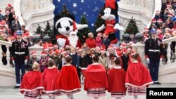 Prince Albert II of Monaco and his wife Princess Charlene attend the traditional Christmas tree ceremony at the Monaco Palace as part of Christmas holiday season in Monaco.