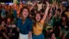 Soccer fans celebrate the second goal scored by Brazil striker Neymar, during a live broadcast at a World Cup viewing party at the Jockey Club, in Rio de Janeiro, Brazil, Thursday, June 12, 2014.