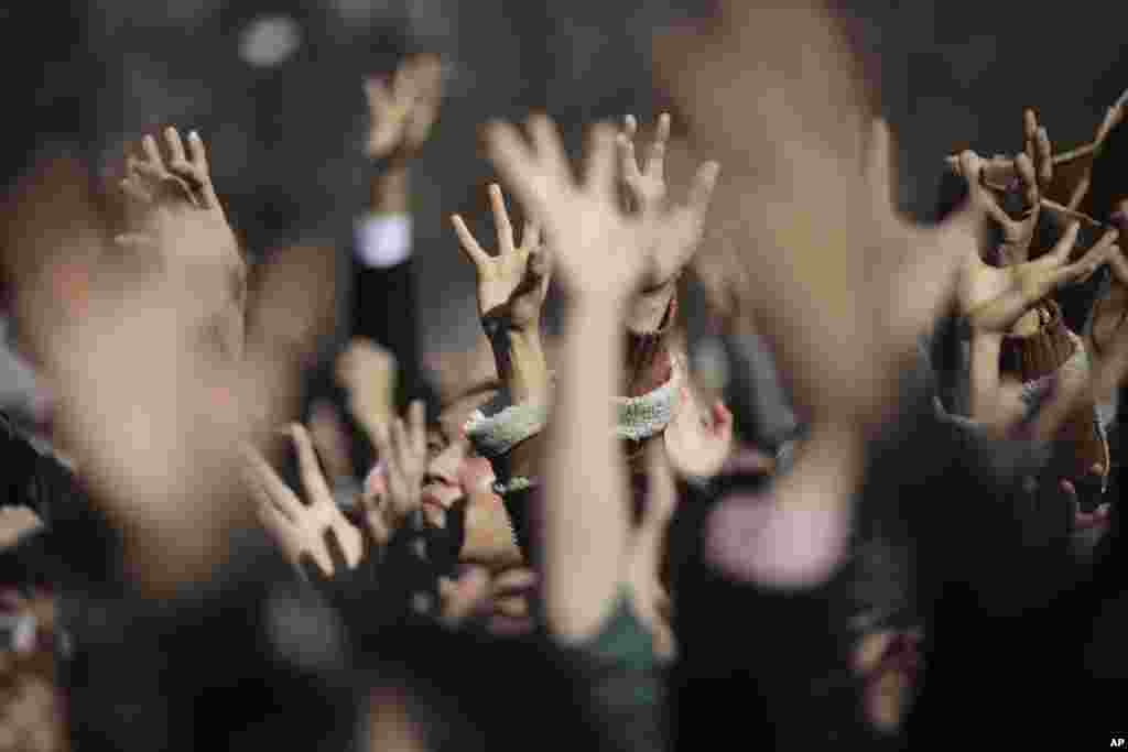 People try to catch lucky beans scattered by celebrities during &quot;Mame-maki,&quot; a bean throwing ceremony, at Zojyoji Buddhist temple in Tokyo, Japan.
