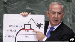 Israel's Prime Minister Benjamin Netanyahu points to a red line he drew on the graphic of a bomb used to represent Iran's nuclear program as he addressed the 67th United Nations General Assembly in New York, Sept. 27, 2012.