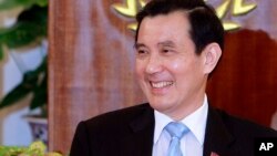 FILE - Former Taiwan's President Ma Ying-jeou addresses media during a press conference at the Presidential Office in Taipei, Nov. 5, 2015. Taiwan has bared him from a visit to Hong Kong.