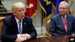 Senate Majority Leader Mitch McConnell, R-Ky., right, listens as President Donald Trump speaks during a meeting with Congressional leaders and administration officials on tax reform, in the Roosevelt Room of the White House, Tuesday, Sept. 5, 2017, in Washington.