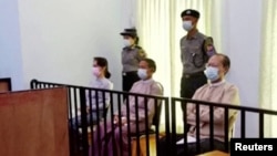 Myanmar's ousted leader Aung San Suu Kyi, former president Win Myint and doctor Myo Aung appear at a court in Naypyitaw, Myanmar May 24, 2021, in this still image taken from video. (MRTV/REUTERS TV/via REUTERS)