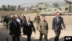 U.S. Defense Secretary Jim Mattis, second left, arrives at NATO's Resolute Support mission in Kabul, Sept. 7, 2018. (AFP PHOTO / Thomas WATKINS )